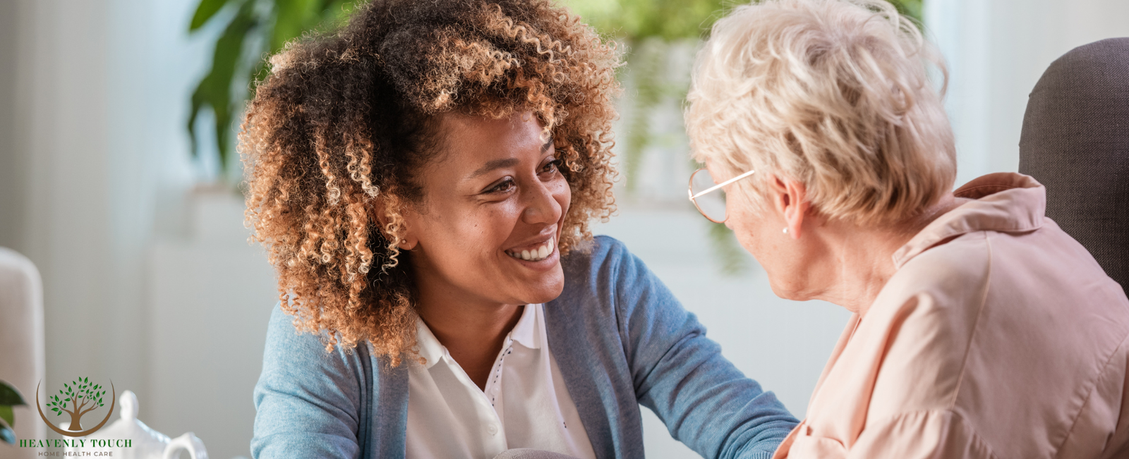 A caregiver and client sharing a warm smile