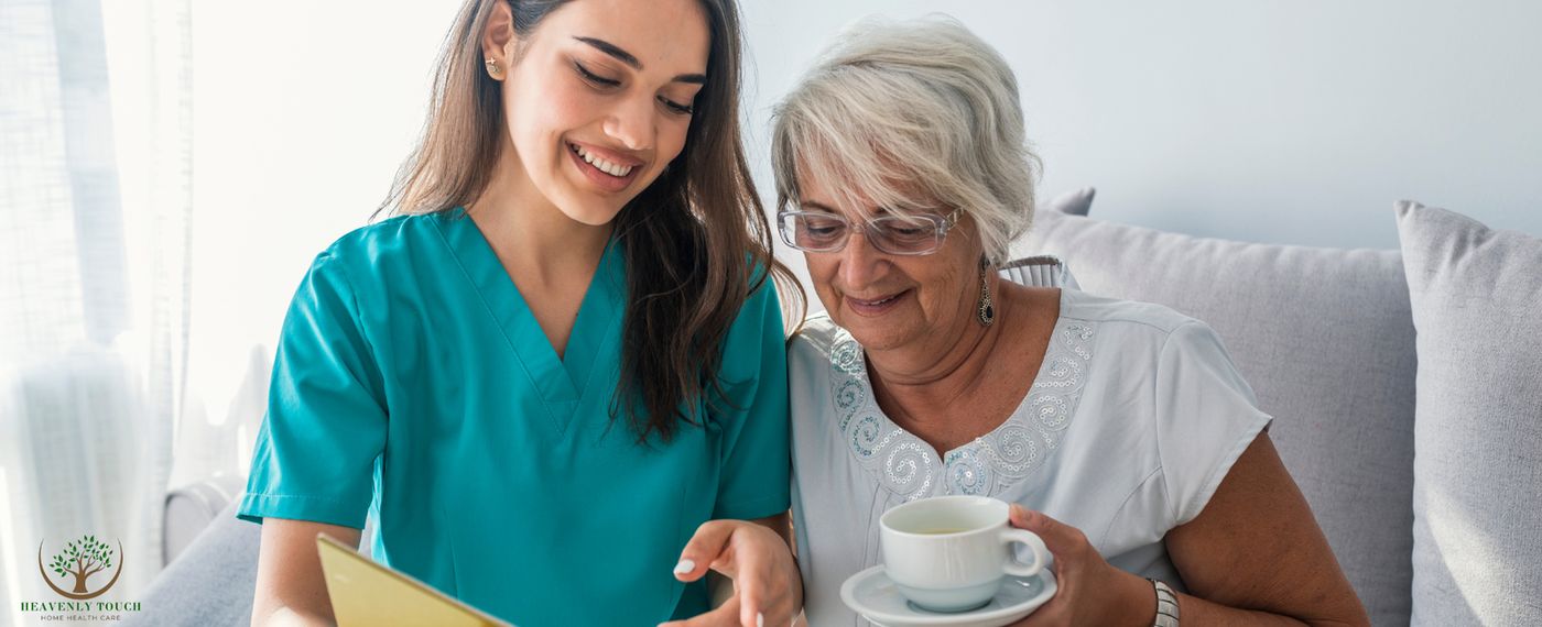 A smiling caregiver sharing a moment with an older woman at home