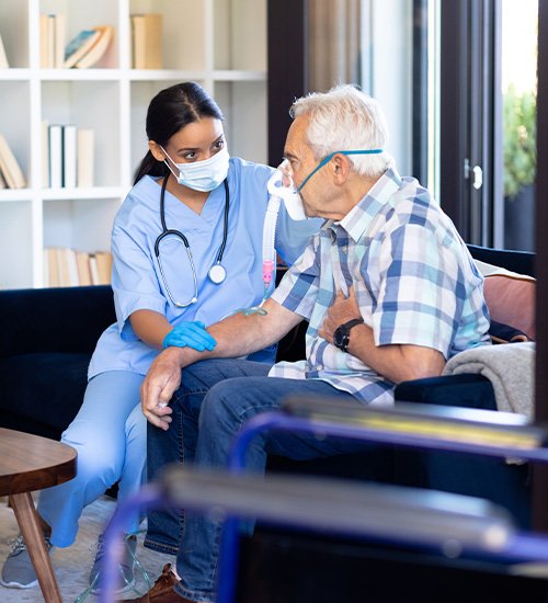 A caregiver assisting a client at home